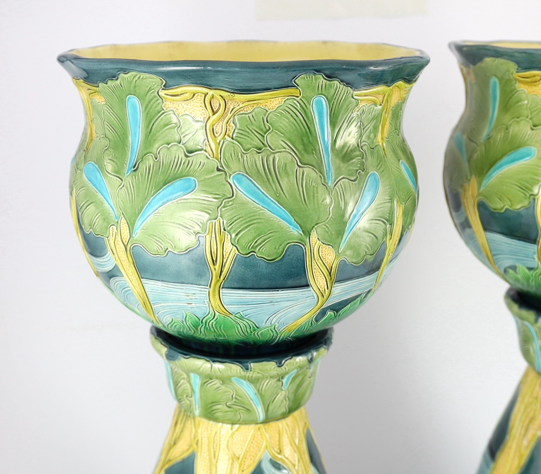 A pair of Burmantofts Art Nouveau faience jardinieres on matching pedestals, c.1900, total height 69cm, diameter 32cm, minor faults